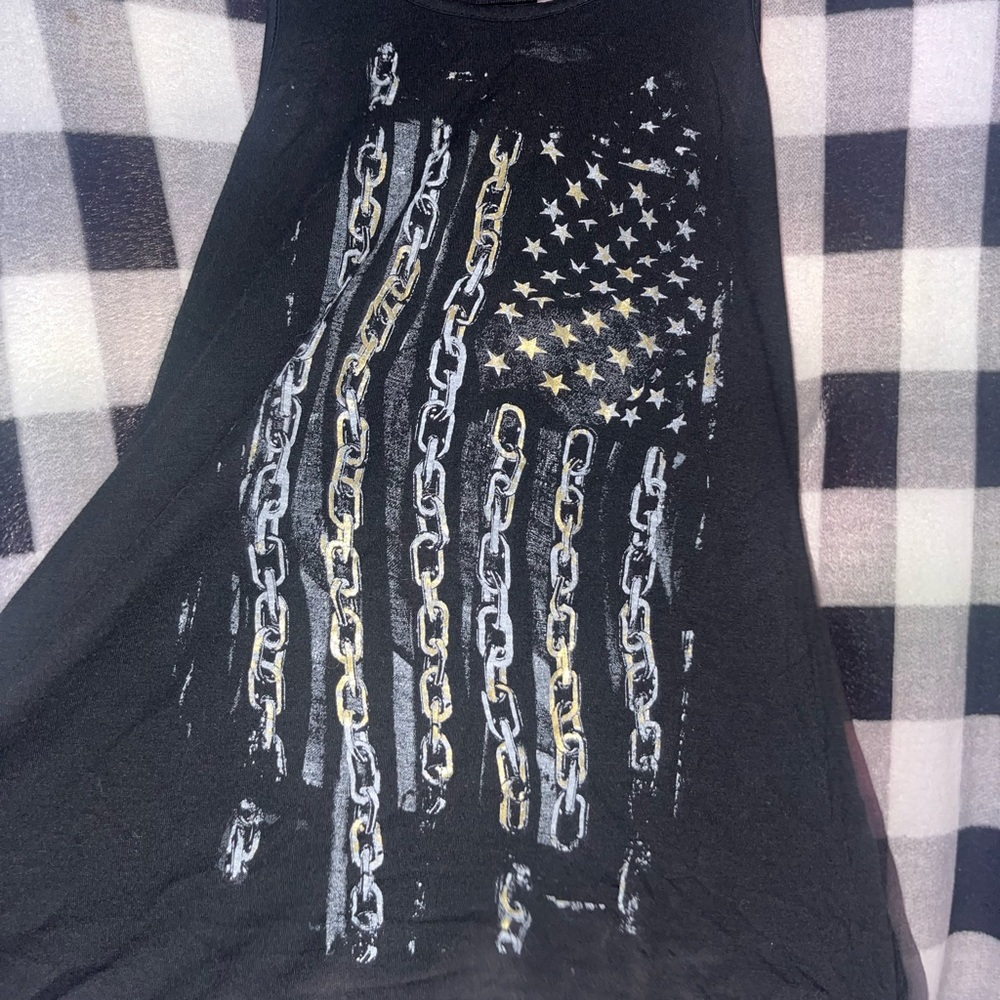 black tank top with open back and gold and white details. social misfits medium.